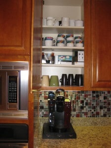 Coffee station cabinet after kitchen organization.
