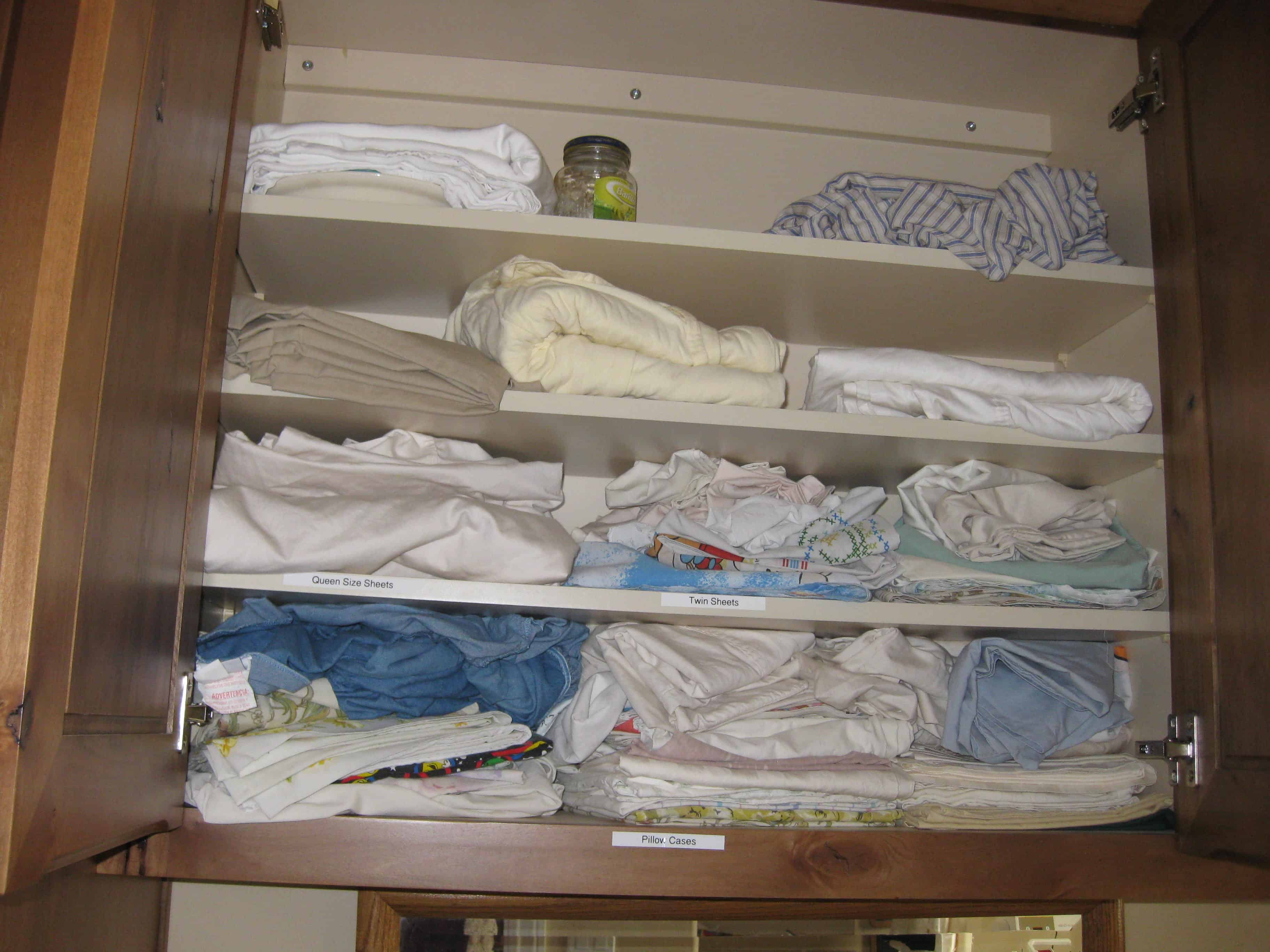 Unorganized Linen Closet - Before